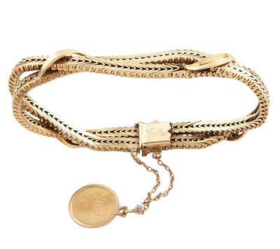 PULSERA DE DOBLE CADENA EN ORO 18KT. Pulsera realizada en oro de 18kt. Formada por dos cadenas 