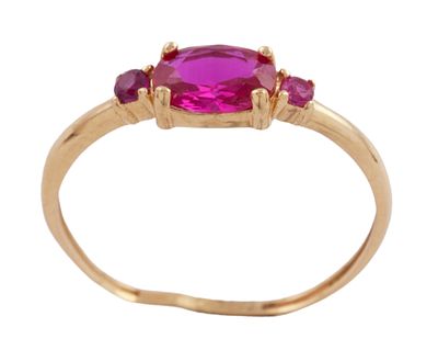 SORTIJA EN ORO DE 18 KT. CON PIEDRA CENTRAL ROJA Y RUBIES. Sortija realizada en oro de 18 kt. 