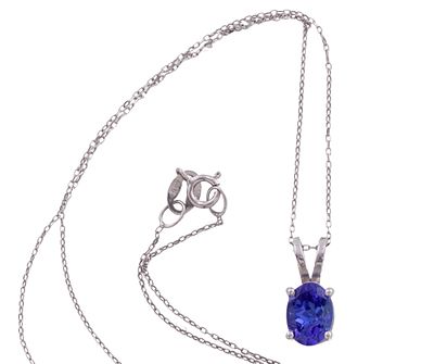 COLGANTE Y CADENA EN ORO DE 18 KT. CON TANZANITA. Colgante y cadena realizados en oro de 18 kt. 