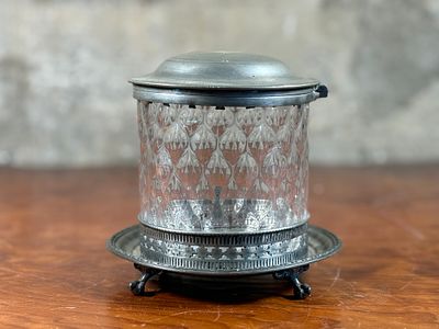 PEWTER & GLASS BISCUIT BARREL. This lot features an antique pewter &amp; glass biscuit barrel in 