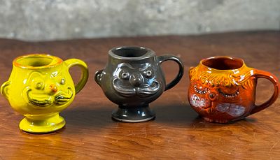 PACIFIC STONEWARE MUGS. This lot features a set of three Pacific Stoneware mugs with maker marks 