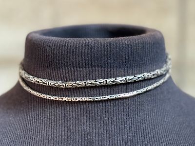 PAIR OF STERLING SILVER BYZANTINE NECKLACES. This lot features a pair of sterling silver 