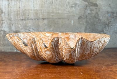 BOHO CARVED WOODEN CLAM SHELL BOWL. This lot features a boho carved wooden clam shell bowl in 