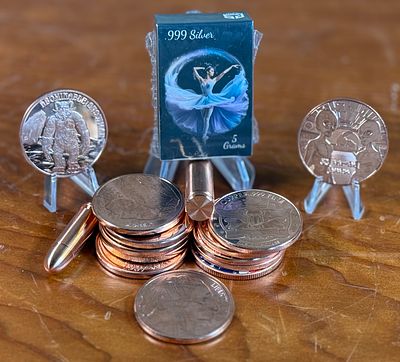 SILVER & COPPER COLLECTION. This lot features sixteen (16) ounces of copper with various designs 