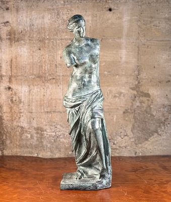 VENUS DE MILO SCULPTURE. This lot features a famous replica of the Venus de Milo, one of the 