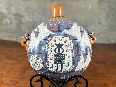 ALVARO COFOYOTE, PUEBLO CANTEEN. This lot features a stunning Pueblo canteen, signed by artist 