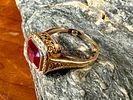 10K GOLD RING. This lot features an antique 10k gold ring with what appears to be a large Ruby Image - 3
