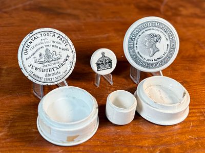 VICTORIAN TOOTHPASTE CERAMIC POTS. This lot features three (3) Victorian toothpaste ceramic pots 