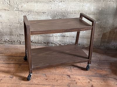 MID-CENTURY CART. This lot features a vintage mid-century style cart on casters and measures 