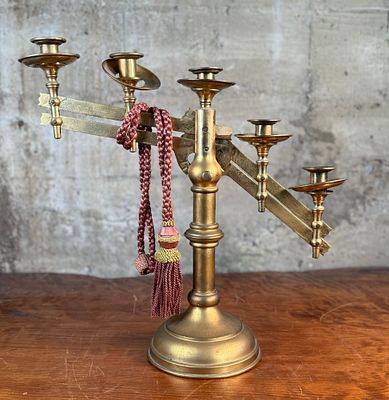 ADJUSTABLE BRASS CHURCH CANDELABRA. This lot features an antique brass church candelabra with 