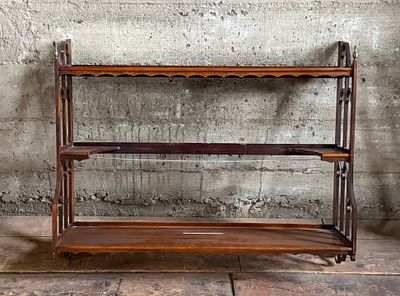 VICTORIAN THREE-TIER WALL SHELF. This lot features a Victorian three-tier wall shelf that 