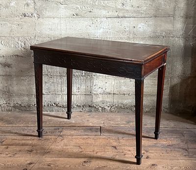 GEORGE III MAHOGANY GAME TABLE. This lot features an antique George III solid mahogany game 