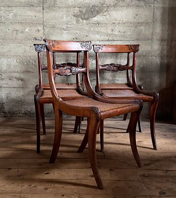 SET OF FIVE REGENCY STYLE MAHOGANY CANED DINING CHAIRS. This lot features a set of five regency 