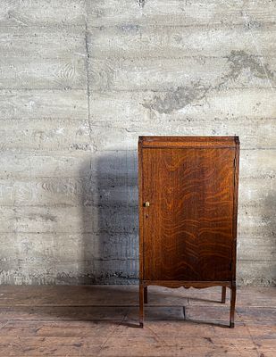 TIGER OAK SINGLE-DOOR MUSIC CABINET. This lot features an antique Tiger Oak single-door music 
