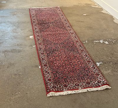 PERSIAN BIDJAR RUNNER RUG. This lot features a Persian Bidjar runner, a type of handwoven 