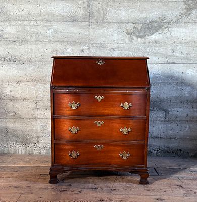 MAHOGANY SLANT-FRONT SECRETARY DESK. This lot features an antique mahogany slant-front secretary 