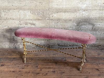 SPANISH GILT IRON BENCH. This lot features a vintage Spanish gilt iron bench with a pink/purple 
