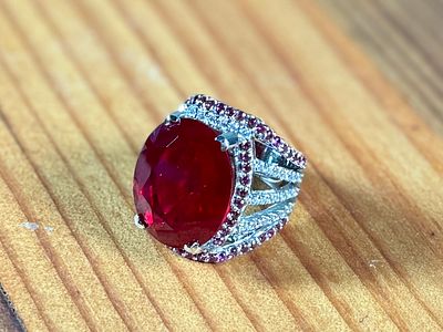 LARGE 30+ CARAT OVAL RUBY COCKTAIL RING. This lot features a statement piece! A large 30+ carat 