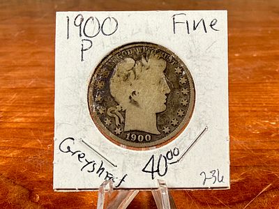 1900 BARBER HALF DOLLAR . This lot features a 1900 Barber Half Dollar, an antique United States 