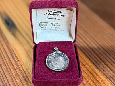 SILVER COIN PENDANT OF QUEEN ISABELLA OF SPAIN, .999 FINE SILVER. This item is a commemorative 