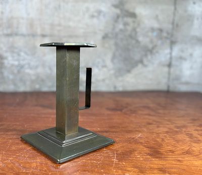 BRADLEY & HUBBARD, BRASS CANDLESTICK HOLDER. This lot features an Arts &amp; Crafts style brass 