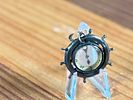 SHIP'S WHEEL COMPASS PENDANT. This lot features an antique ship's wheel compass pendant.Image - 2