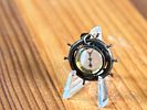 SHIP'S WHEEL COMPASS PENDANT. This lot features an antique ship's wheel compass pendant.Image - 1