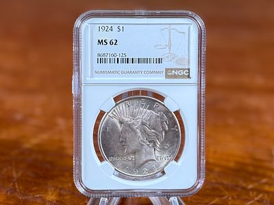 1924 PEACE DOLLAR MS62. This lot features a MS62 1924 Peace Dollar.
