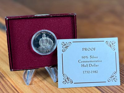 GEORGE WASHINGTON SILVER HALF-DOLLAR. This lot features a commemorative George Washington silver 