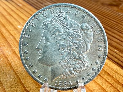 1884-O MORGAN DOLLAR. This lot features a 1884-O Morgan Dollar.