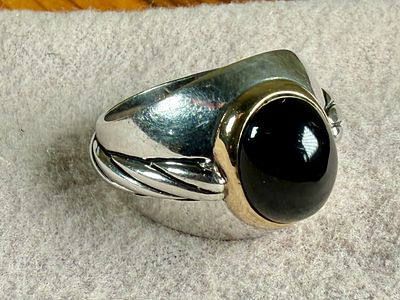 14K GOLD RING WITH STERLING SILVER & ONYX. This lot features a ring made from 14k gold and 