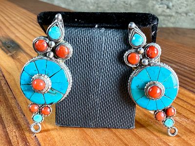 SILVER, TURQUOISE AND CORAL EARRINGS. Silver earrings featuring circular design elements inlaid 