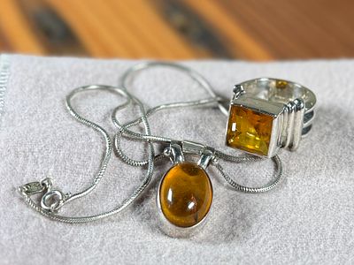 STERLING SILVER & AMBER RING/NECKLACE SET. This lot features a stunning ring and necklace made 