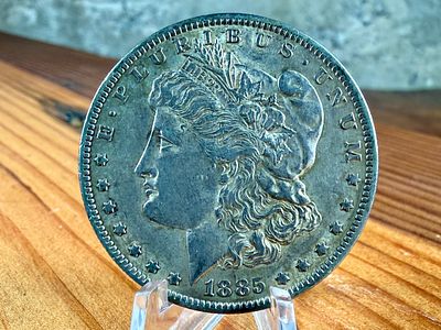 1885-O MORGAN DOLLAR. This lot features a 1885-O Morgan Dollar.