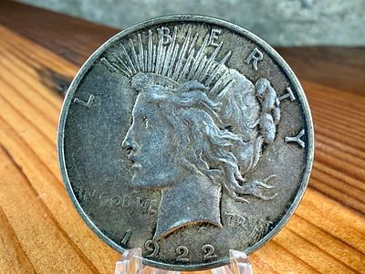1922-D PEACE DOLLAR. This lot features a 1922-D Peace Dollar.