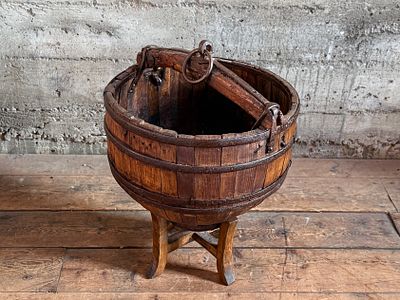 CHINESE WOODEN WATER BUCKET WITH STAND. An antique Chinese wooden water bucket with stand. 