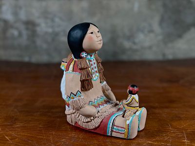 CLEO TEISSEDRE, INDIAN STORYTELLER. This lot features an Indian storyteller sculpture by listed 