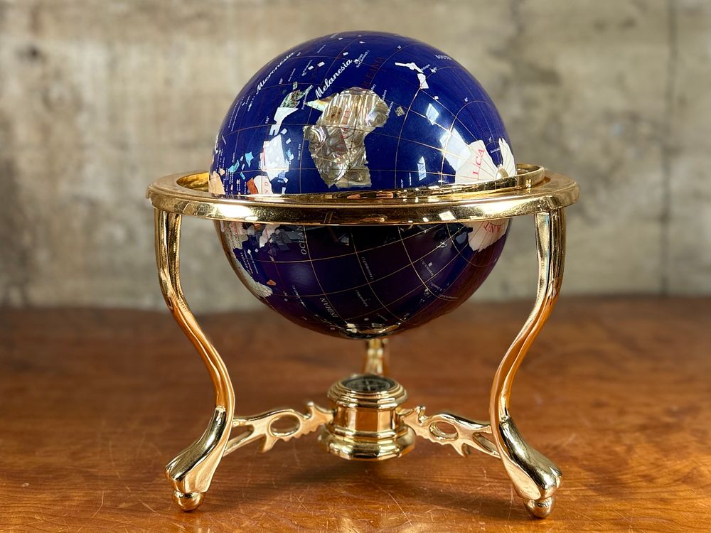 BLUE LAPIS GEMSTONE GLOBE #1. This lot features a vintage blue lapis gemstone globe with a gold 