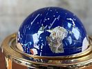 BLUE LAPIS GEMSTONE GLOBE #1. This lot features a vintage blue lapis gemstone globe with a gold Image - 1