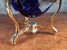 BLUE LAPIS GEMSTONE GLOBE #1. This lot features a vintage blue lapis gemstone globe with a gold Image - 2