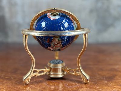 BLUE LAPIS GEMSTONE GLOBE #2. This lot features a vintage blue lapis gemstone globe with a gold 