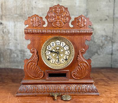 INGRAHAM 8 DAY CLOCK. This lot features an Ingraham 8 day clock circa 1896 in good working 