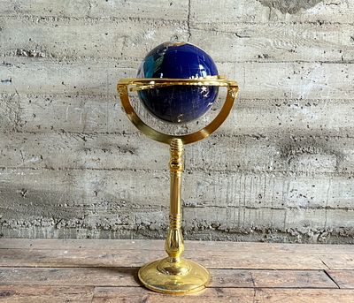 LAPIS GEMSTONE WORLD GLOBE WITH STAND. This lot features a lapis lazuli gemstone world globe 