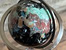 GEMSTONE GLOBE WITH BLACK ONYX OCEAN ON STAND. This lot features a vintage gemstone globe with a Image - 2