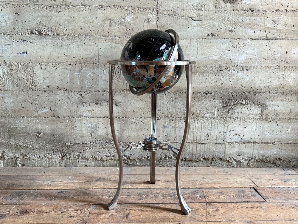 GEMSTONE GLOBE WITH BLACK ONYX OCEAN ON STAND. This lot features a vintage gemstone globe with a 