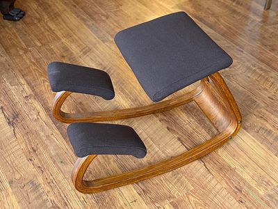 MID-CENTURY KNEELING CHAIR. This lot features a mid-century kneeling chair, likely by Peter 