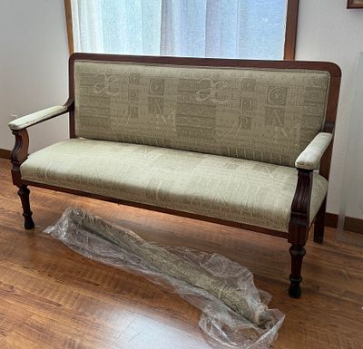 MAHOGANY BENCH WITH NEW UPHOLSTERY. This lot features an antique mahogany bench with a newly 