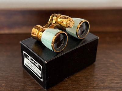 BUSHNELL, OPERA GLASSES. This lot features a pair of opera glasses manufactured by Bushnell. 