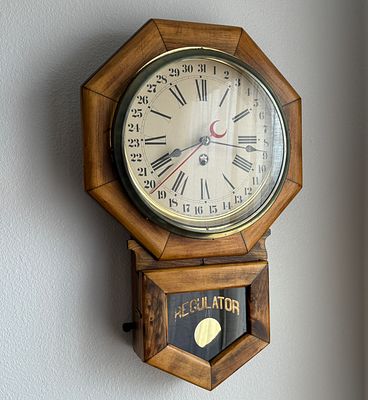 NEW HAVEN, REGULATOR CLOCK. This lot features a regulator clock by New Haven in running condition.