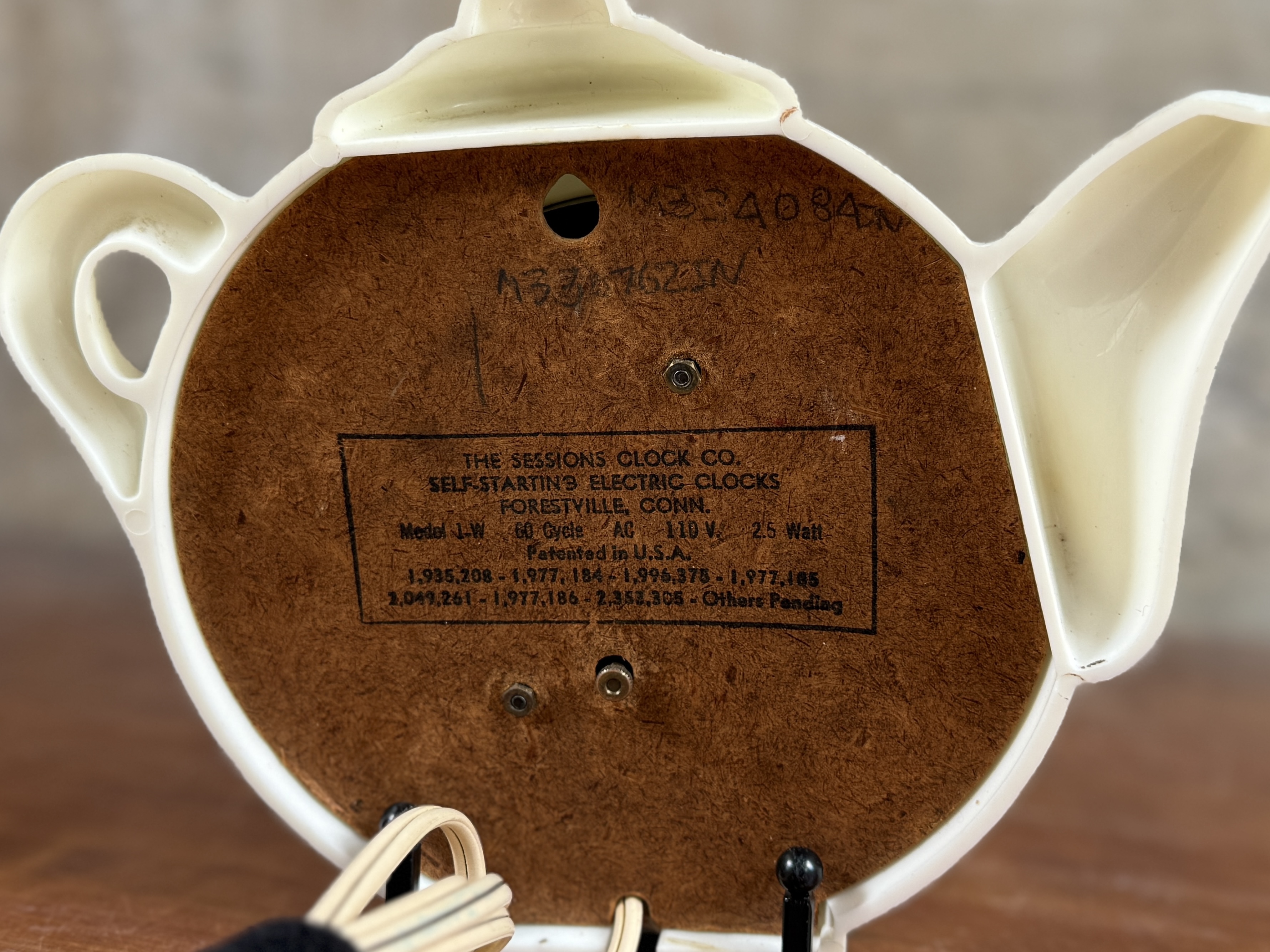 SESSIONS, SELF-STARTING WHITE TEAPOT WALL CLOCK